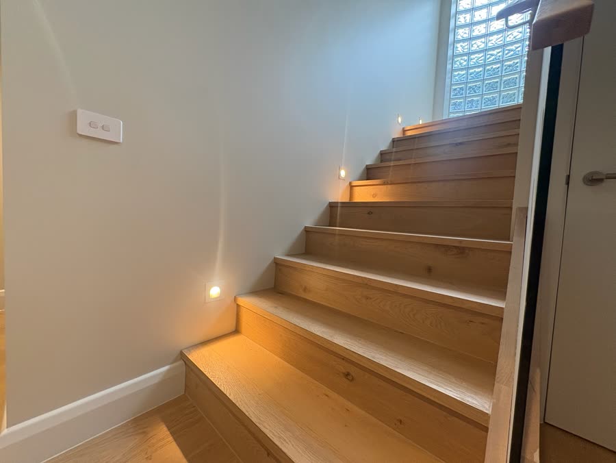Stairwell with integrated step lighting